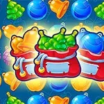 Hình ảnh các túi đỏ chứa đựng trái cây và quà tặng nhiều màu trên nền xanh, với các loại hoa quả xung quanh như táo, nho, cam và quả thông