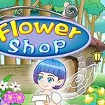 Biển hiệu Flower Shop trên nền cửa hàng hoa với một nhân vật tiên có tóc xanh đứng cạnh, xung quanh là các loài hoa đầy màu sắc