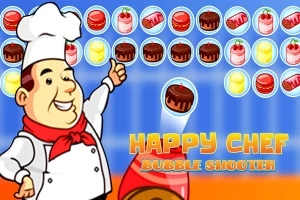 Đầu bếp vui vẻ đang chỉ tay về phía các bánh màu sắc trong một trò chơi bắn bóng