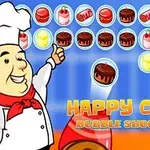 Đầu bếp vui vẻ đang chỉ tay về phía các bánh màu sắc trong một trò chơi bắn bóng